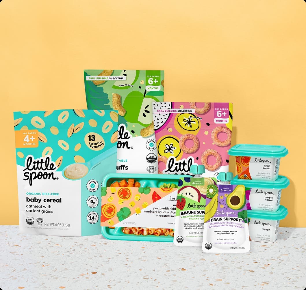 Little Spoon product lineup, including organic oatmeal baby cereal, kale apple curls, banana papaya rings, a Biteables tray, and assorted Babyblends containers, arranged against a yellow background.